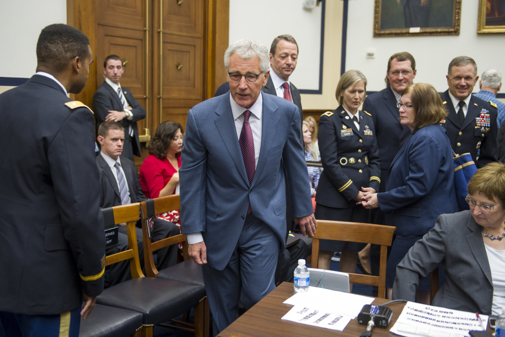 Secretary of Defense Chuck Hagel walks to the witness table to testify before the House Armed Services Committee on Capitol Hill in Washington on Thursday. Hagel reiterated that if the Islamic State militants are left unchecked, they will threaten the United States and its allies.