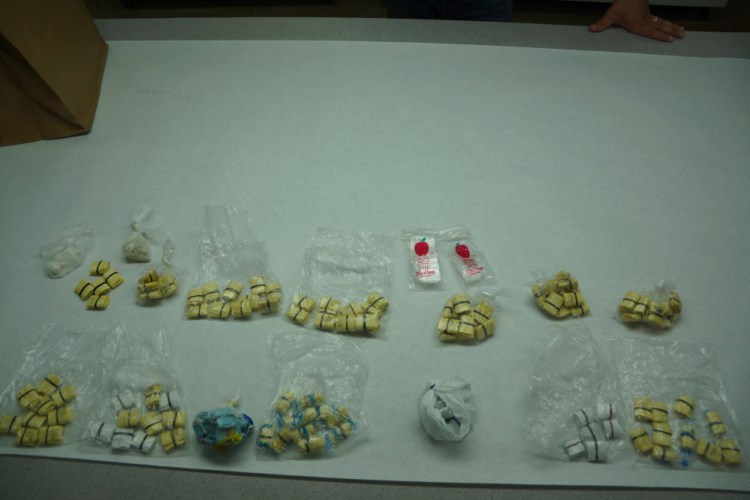 Augusta police display illegal drugs they say were seized in a raid Wednesday at a River Street residence.