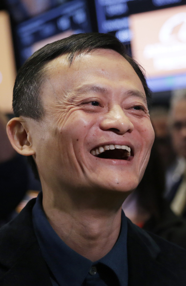 Jack Ma, founder of Alibaba, beams on the floor of the New York Stock Exchange on Friday. “We want to be bigger than Wal-Mart,” he said.