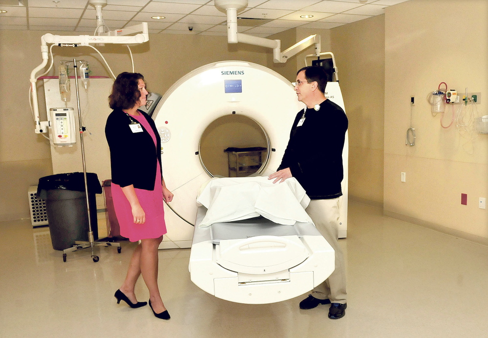 Buffy Higgins, director of Thayer Operations, and technician Bob Blake discuss renovations made to accommodate a new CT scanner at Thayer Center for Health in Waterville.