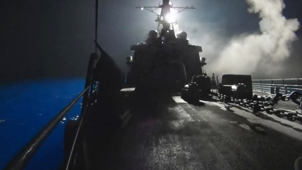 In this image made from video released by the U.S. Navy on Tuesday, missiles bound for Syrian Islamic State group targets are launched off of a U.S. Navy ship.