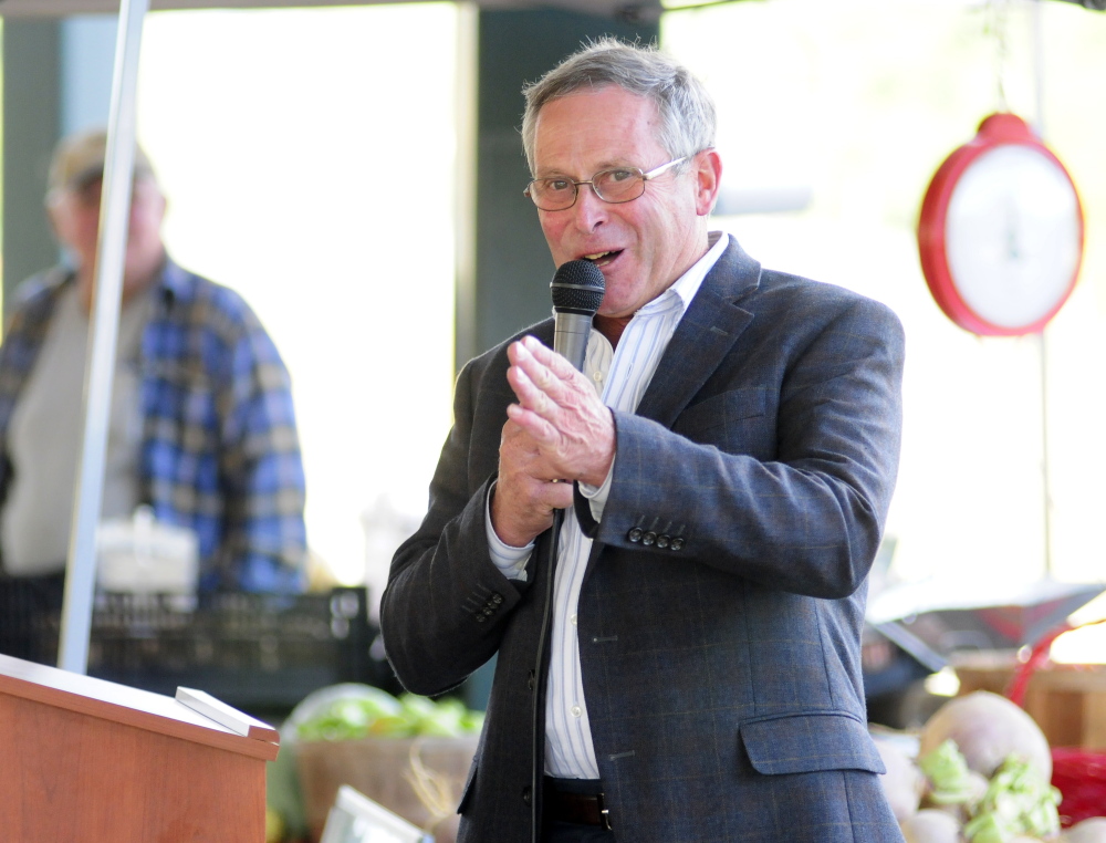 Walt Whitcomb, commissioner of Department of Agriculture, Conservation and Forestry, speaks on Tuesday at the farmers market at Mill Park in Augusta.
