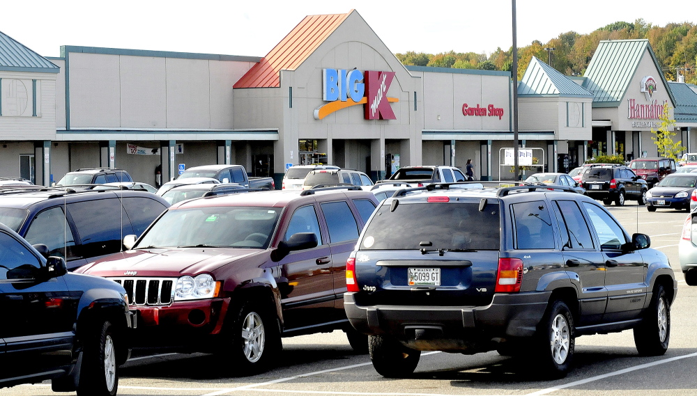The parking lot at Elm Plaza in Waterville is filled with shoppers at stores including Kmart and Hannaford on Tuesday. The owners of the plaza have applied for a TIF district from the city to make improvements.