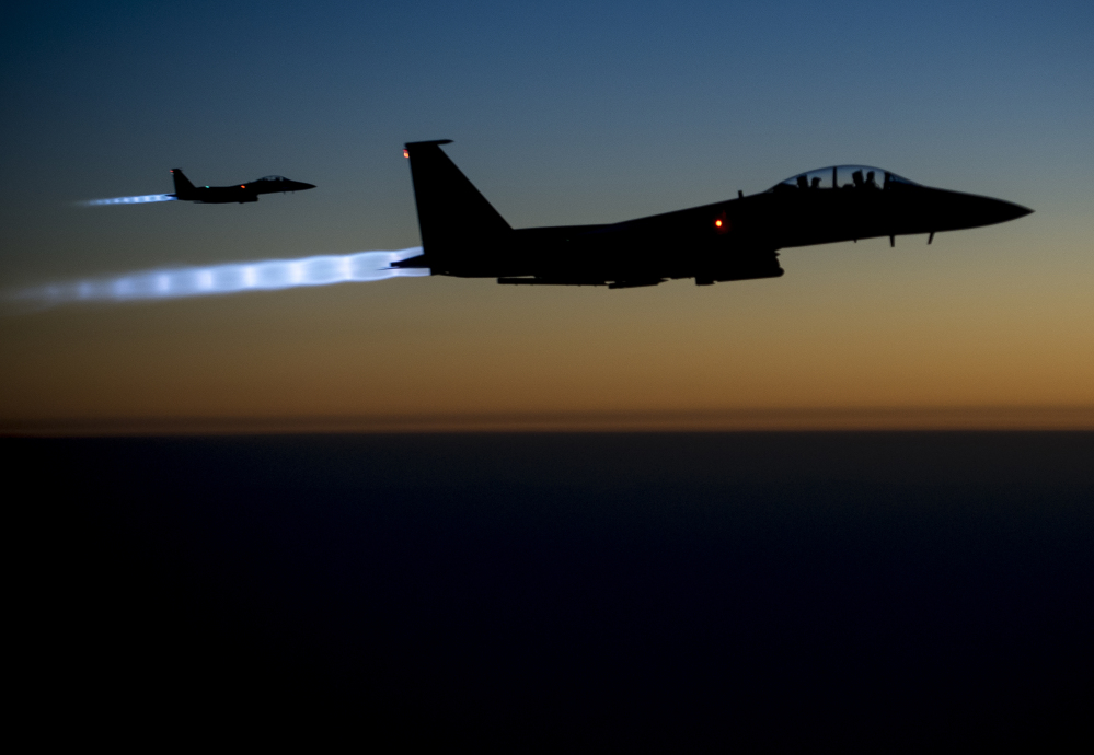 A pair of U.S. F-15E Strike Eagle flies over northern Iraq on Tuesday after conducting airstrikes in Syria.