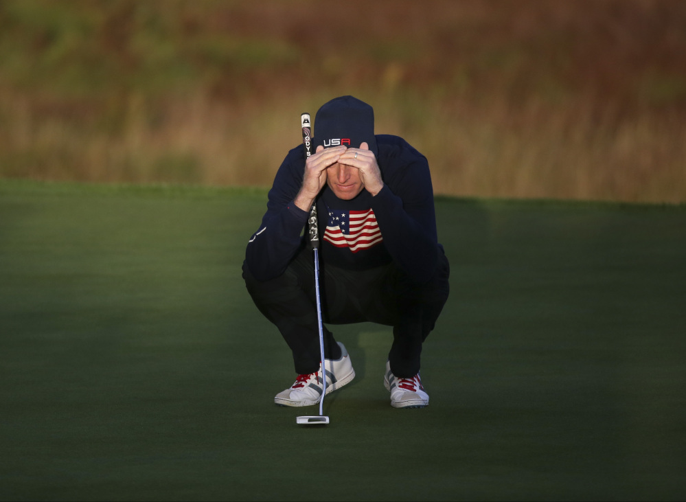 Jim Furyk of the US looks at his putt on the 1st green during the fourball match on the second day of the Ryder Cup golf tournament, at Gleneagles, Scotland, Saturday, Sept. 27, 2014. (AP Photo/Scott Heppell)