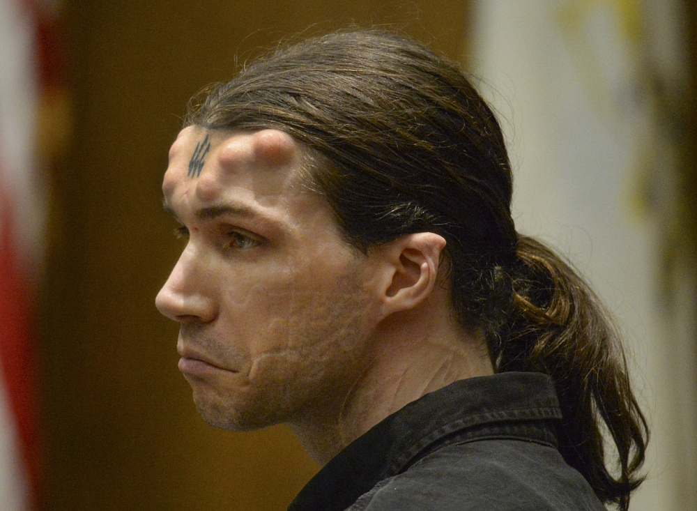Caius Veiovis reacts to guilty verdicts in his triple murder trial in Hampden Superior Court Friday in Springfield, Mass. Veiovis is the third of three defendants charged with the 2011 killings of David Glasser, Edward Frampton and Robert Chadwell, of Pittsfield, Mass.
