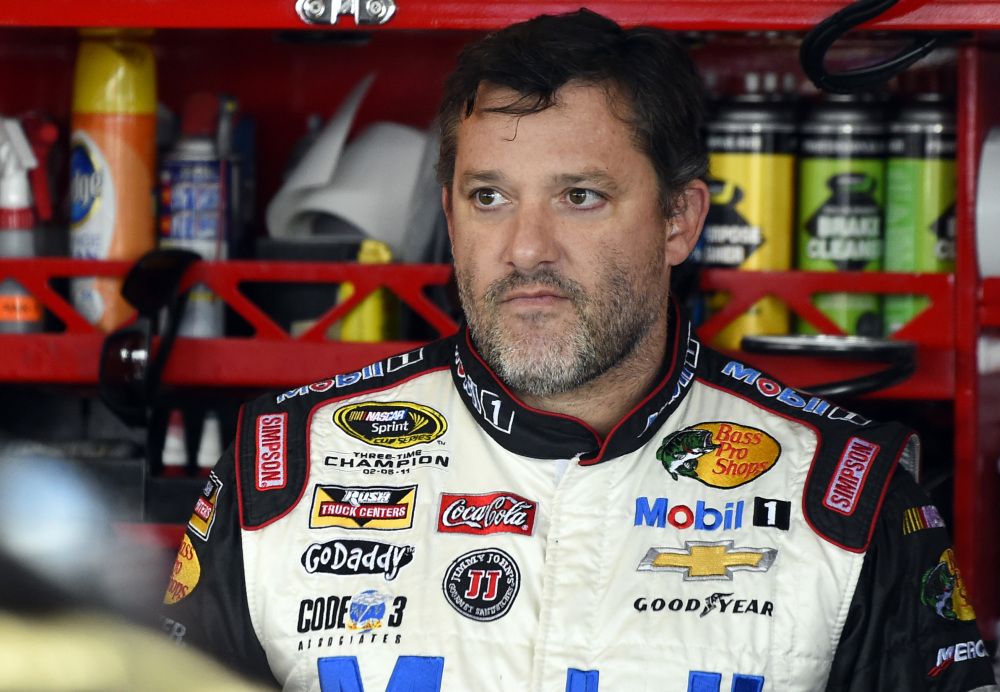 In this Sept. 13, 2014, file photo, Tony Stewart looks out from his garage during practice for the NASCAR Sprint Cup series auto race at Chicagoland Speedway in Joliet, Ill.