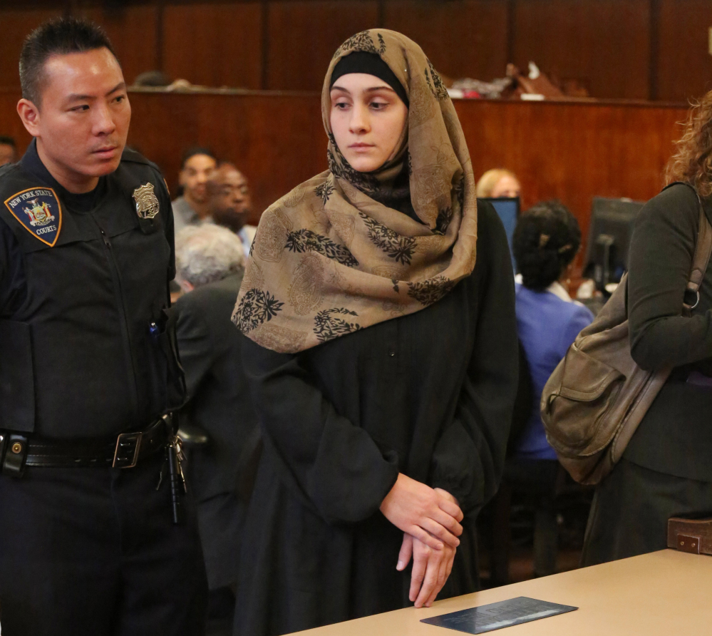 Ailina Tsarnaeva, sister of Boston Marathon bombing suspect Dzhokhar Tsarnaev, is escorted by a court officer during her appearance in Manhattan Criminal Court Tuesday in New York.