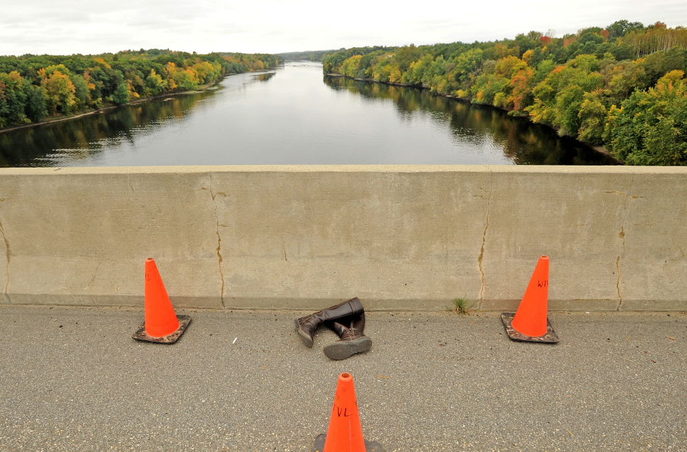 Pictured are the boots of woman who jumped from Carter Memorial Bridge on the Winslow and Waterville town line on Tuesday, Sept. 30, 2014. 