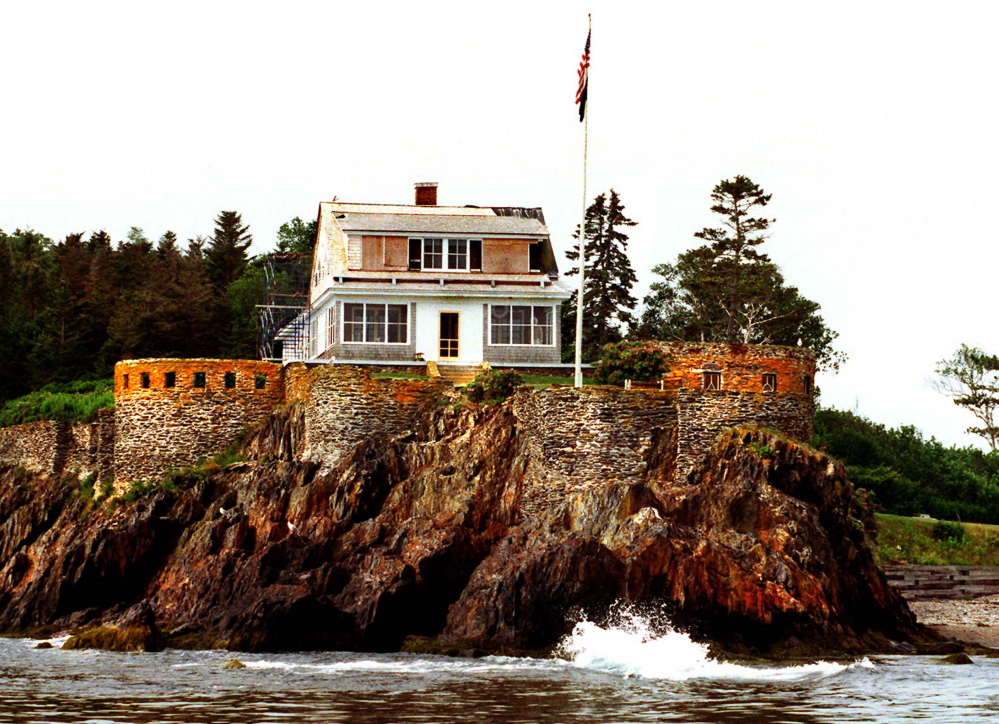 The Eagle Island home of Adm. Robert Peary sits atop a water-lapped ledge in this photo taken prior to some repairs being made.