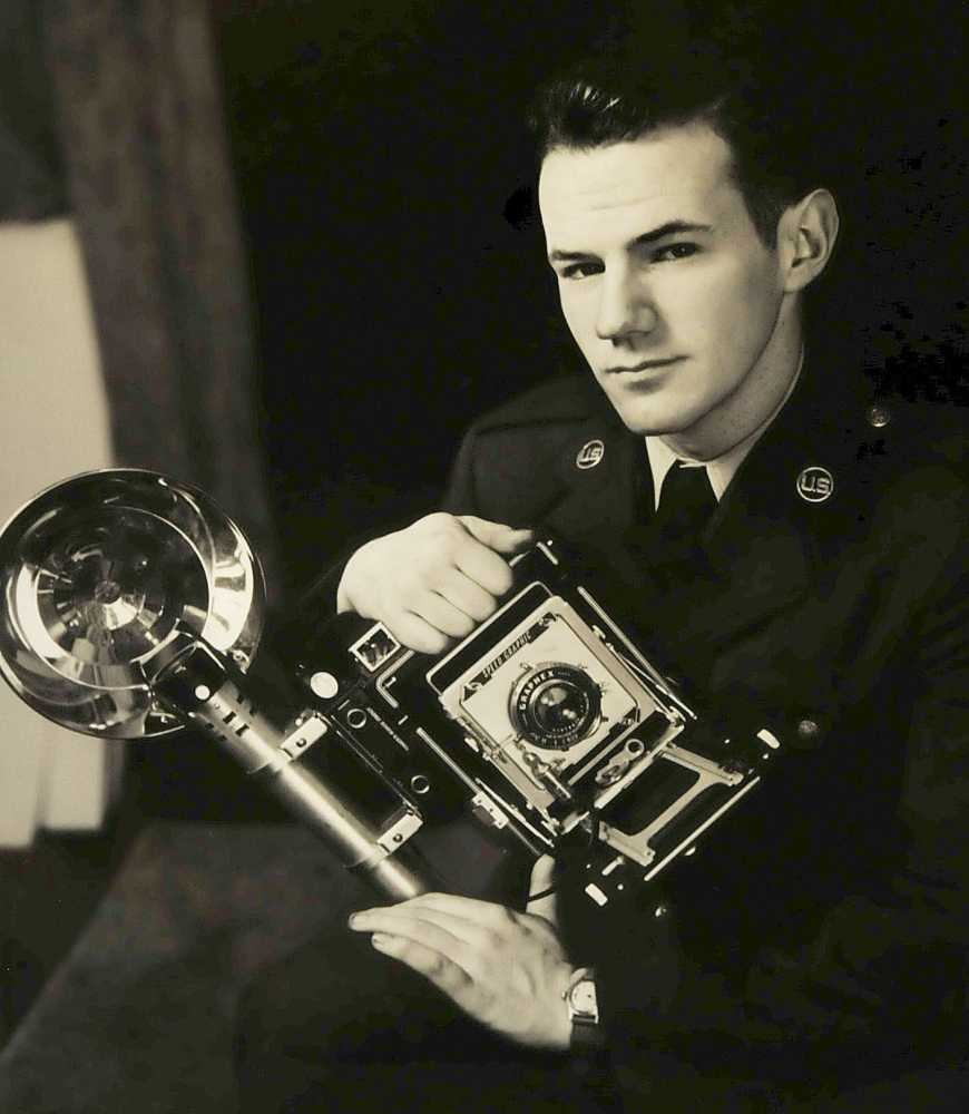 This self-portrait of Galen Leavitt with the camera he used during the Korean War is on display along with other photographs at an Oakland Library exhibit that opens Wednesday