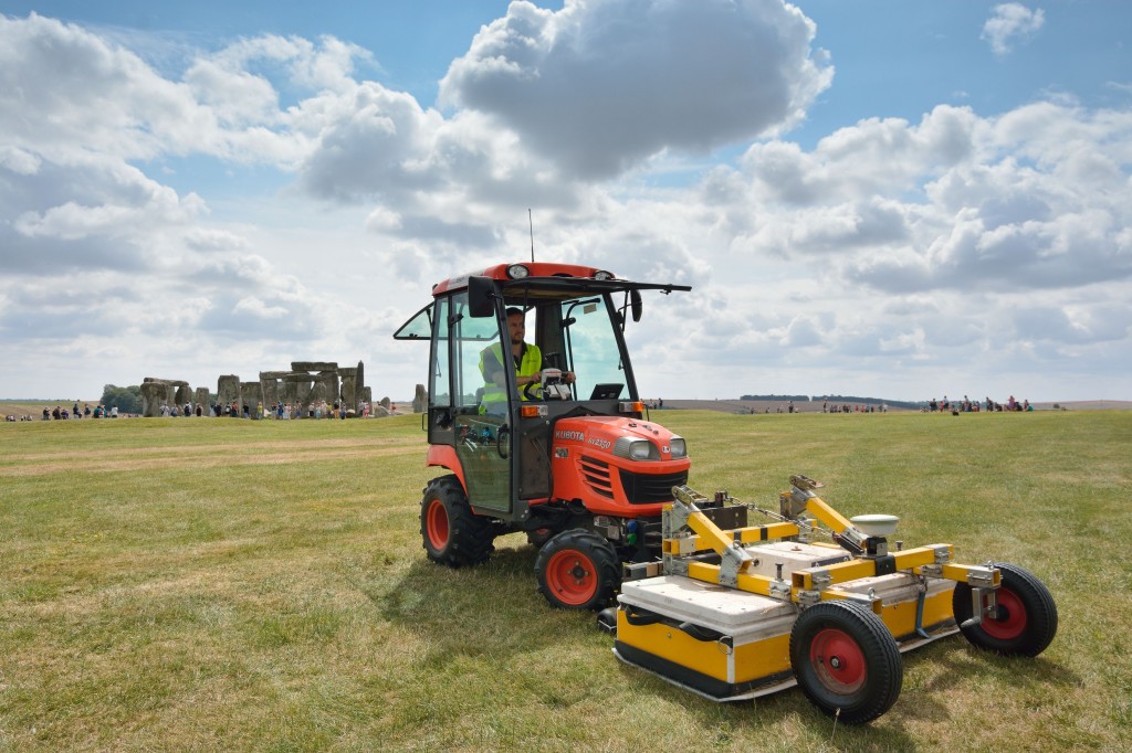 An undated photo made available by the University of Birmingham, England, shows a tractor pushing the surveying vehicle that was used to scan the Earth near Stonehenge.