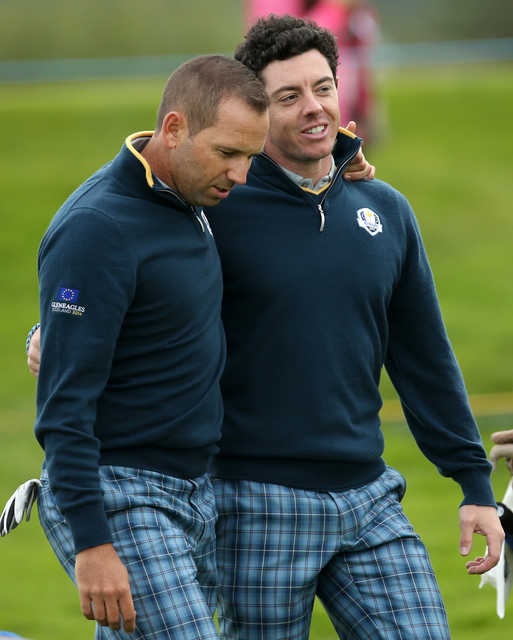 Europe’s Rory McIlroy and Sergio Garcia, left,  walk along the 15th fairway during a practice round Tuesday ahead of the Ryder Cup at Gleneagles, Scotland.