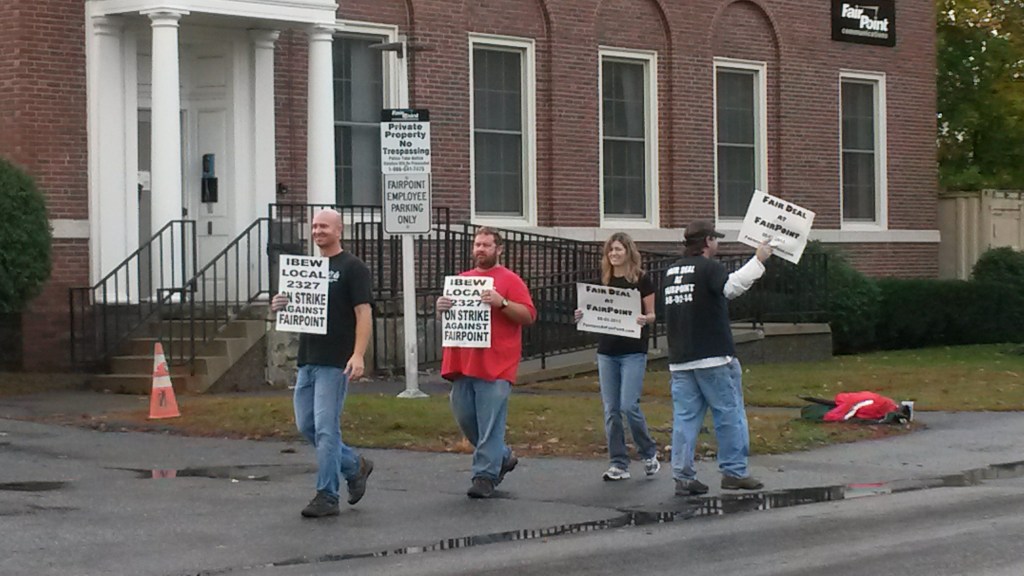 FairPoint workers strike outside building on State Street in Augusta Friday morning. Staff photo by Susan Cover.