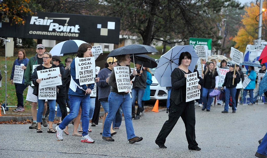 Fairpoint workers on Friday strike march at corner of Davis Farm and Riverside roads in Portland after a walkout at midnight from Fairpoint Communicationslocations around Northern New England. Gordon Chibroski/Staff Photographer