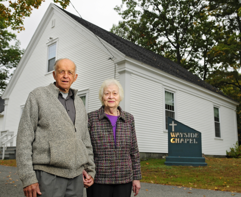 The Rev. Fred and Ella Benner stand outside Wayside Chapel on Wednesday in West Gardiner. When the Rev. Benner opened the church in 1955, the building, now two centuries old, had no electricity. It has been updated and expanded since then.
