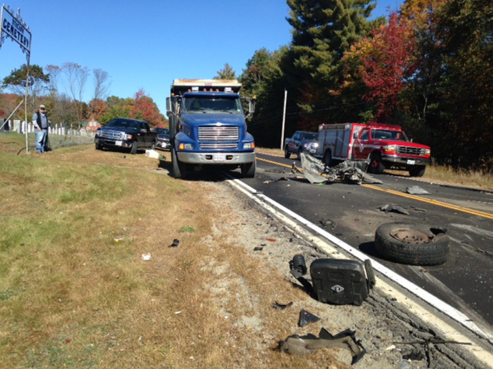 Debris lies scattered along Route 43 in Anson after a pickup truck ran into a dump truck Thursday morning.