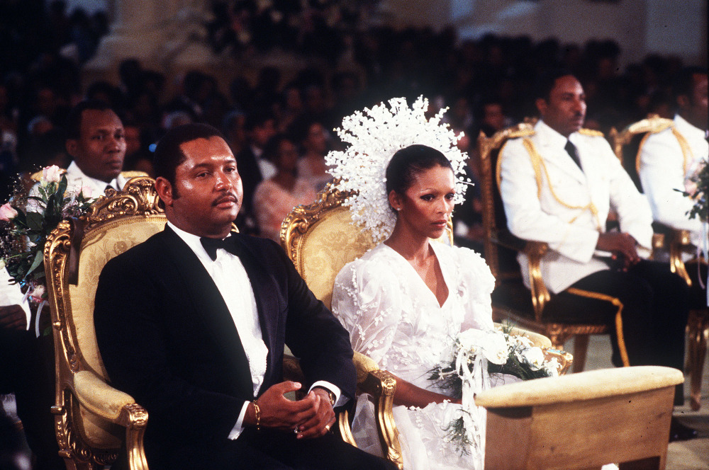 In this May 27, 1980 file photo, then Haitian president Jean-Claude Duvalier, left, is pictured with his bride,  Michele Bennett, during their wedding ceremony in the Port-au-Prince National Cathedral in Haiti.