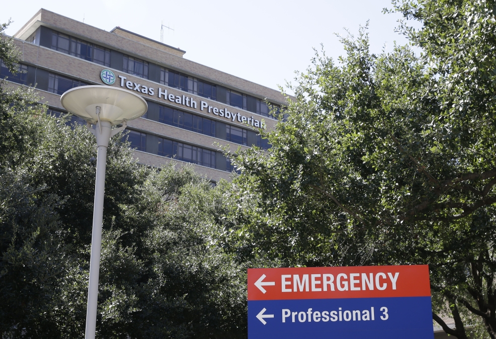 A sign points to the emergency room at Texas Health Presbyterian Hospital  where Thomas Eric Duncan, the Ebola patient who traveled from Liberia to Dallas, is being treated Saturday.