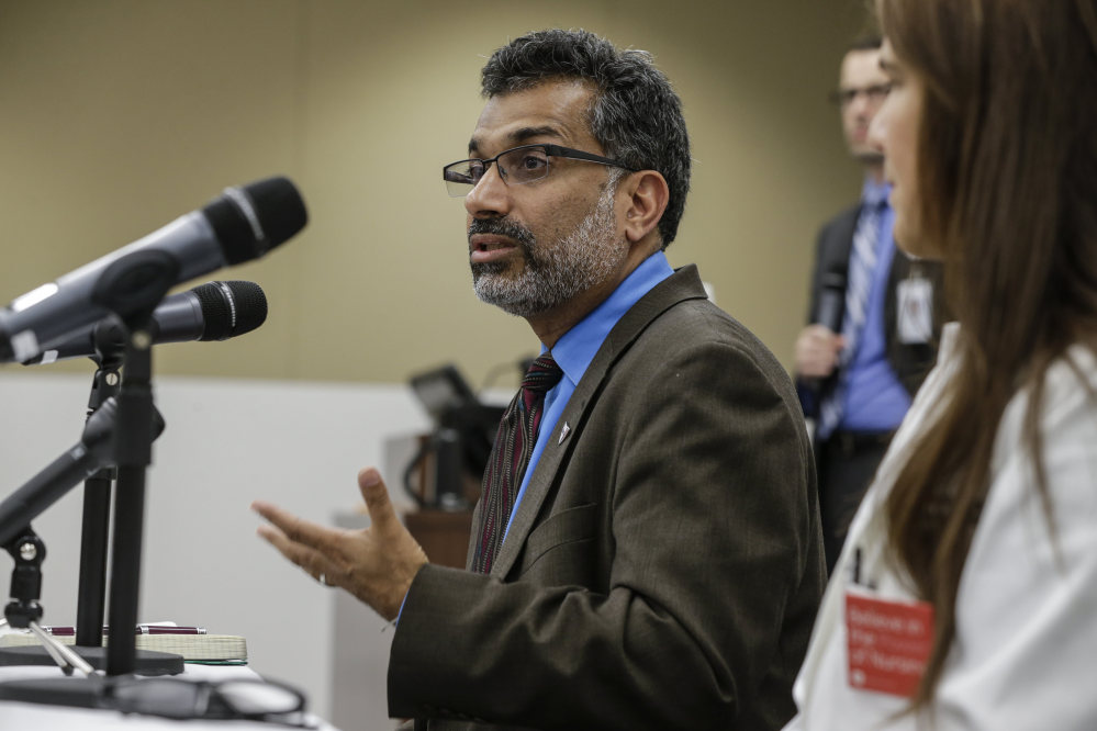 Dr. Ali Khan, Dean of the College of Public Health at the Nebraska Medical Center, speaks during a news conference in Omaha, Neb., Friday to discuss Ebola patient, journalist Ashoka Mukpo, who is expected to arrive from Liberia at the Medical Center on Monday.)
