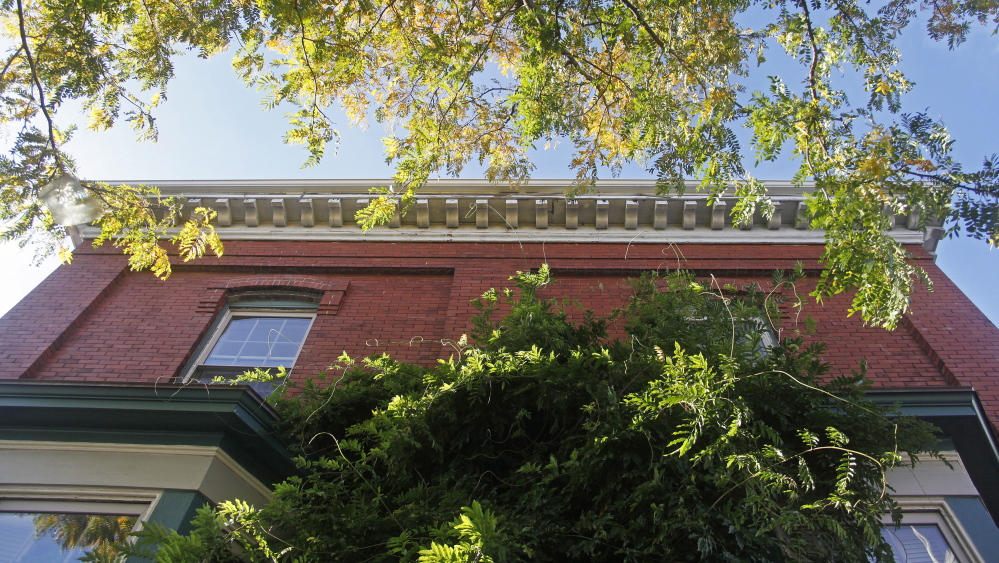 The ornate roofline at 147 Congress St. on Munjoy Hill in Portland where the owners are asking to make it a historic landmark to protect it from ruin after it sells.)