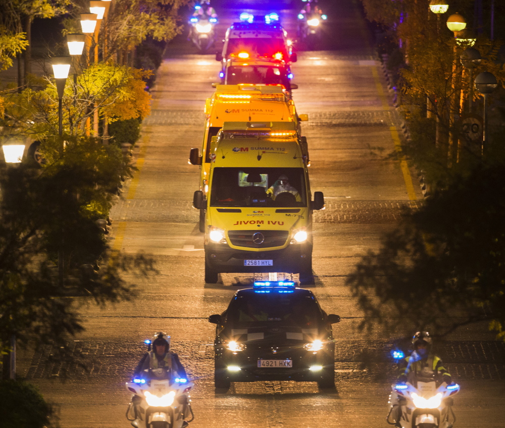 A convoy transports a Spanish nursing assistant believed to have contracted Ebola to Carlos III hospital in Madrid on Tuesday.             leaves Alcorcon Hospital in Madrid, Spain, Tuesday, Oct. 7, 2014. The nurse who treated a missionary for the disease at a Madrid hospital tested positive for the virus, Spain’s health minister said Monday. The female nurse was part of the medical team that treated the Spanish priest who died in a hospital last month after being flown back from Sierra Leone, where he was posted. (AP Photo/Andres Kudacki)