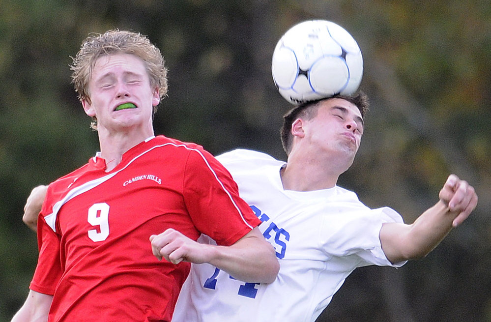 Erskine Academy’s Luke Peabody, right, goes head to head with Camden’s Josiah Simko during a Kennebec Valley Athletic Conference Class B game Tuesday in South China. The Windjammers won 1-0.