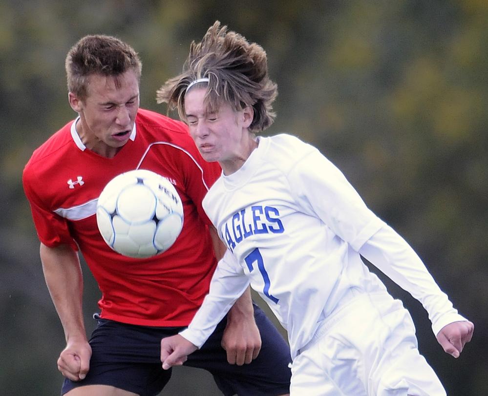 Erskine Academy’s Kyle Zembroski, right, and Camden’s Josiah Krul battle for possession of the ball during a Kennebec Valley Athletic Conference Class B game Tuesday. Camden won 1-0.