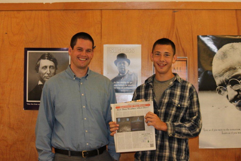 Contributed photo James Tyler, left, and Collin Miller with the published article in the Northwood’s Sporting Journal.
