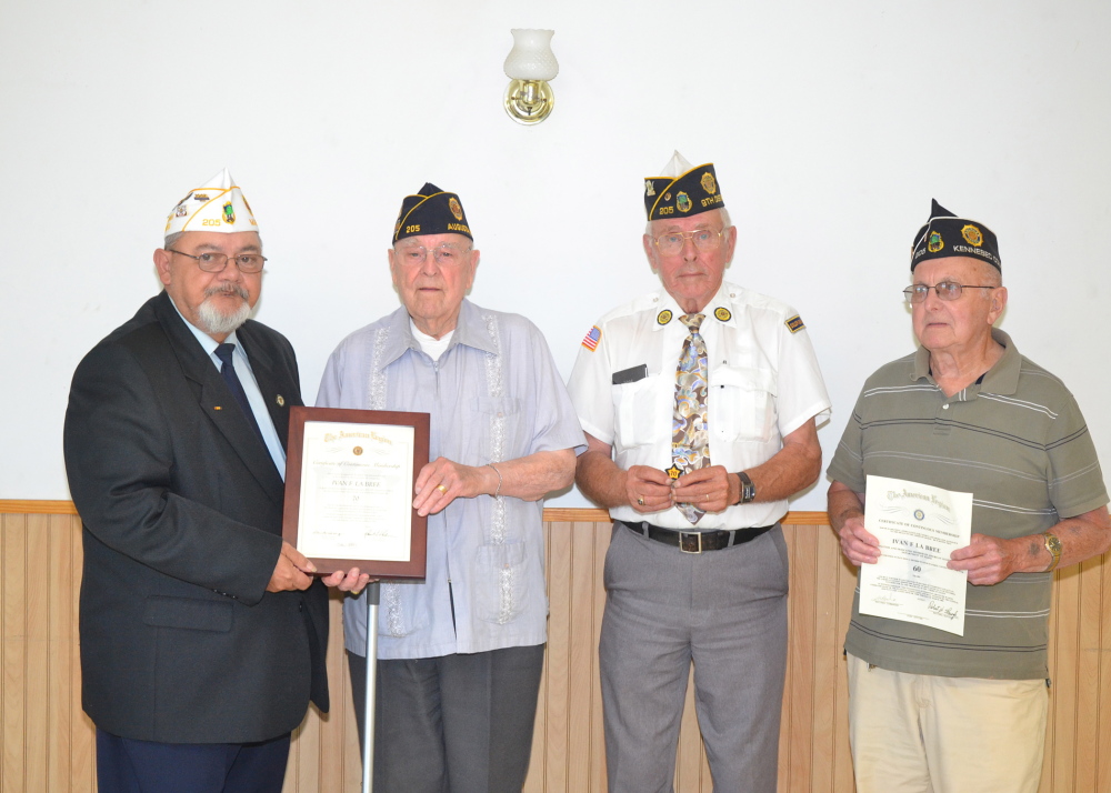 American Legion Post 205 of Augusta recently held a ceremony to honor Ivan LaBree for 70 years of membership. From left is Commander Dean Shelton of American Legion Post 205 presenting LaBree with his 70-year membership certificate; Second Vice Commander George Bean holding LaBree’s hat patch; and Legionnaire Bob Emery holding LaBree’s 60-year certificate in the American Legion, which he had never picked up.