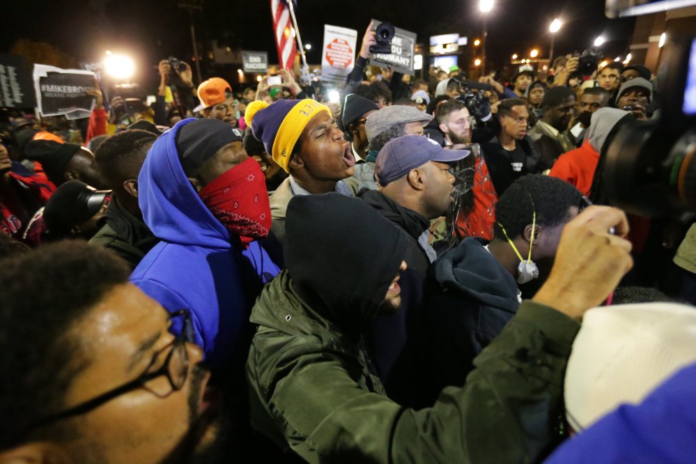 Demonstrators rally in Ferguson on Friday as part of a weekend of planned protests called Ferguson October.