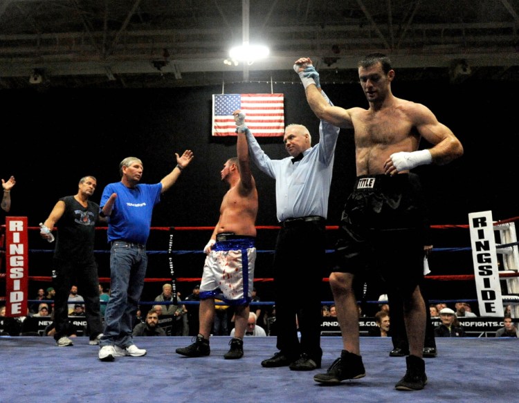 Joel “Baby Bull” Bishop, in white trunks, and Jared “Last Minute” Lawton, finished their fight in a draw Saturday night at the Androscoggin Bank Colisee in Lewiston.