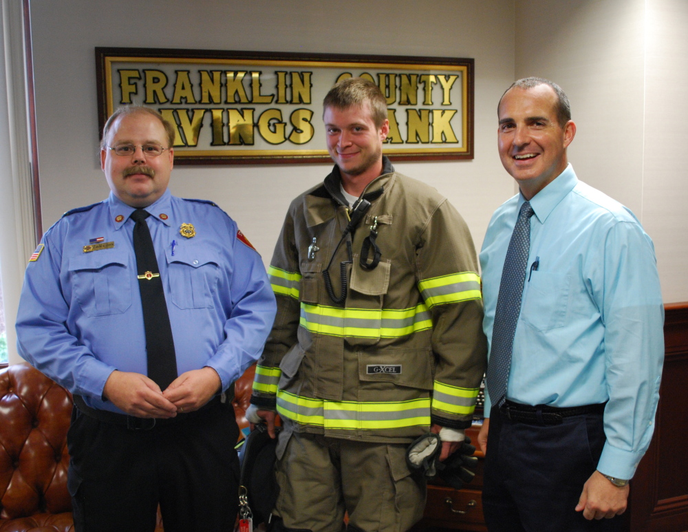 Franklin Savings Bank’s Community Development Foundation recently donated $1,523 to the Strong Fire Department to purchase a National Fire Protection Association suit. Lieutenant Aaron Marden and firefighter Ethan Boyd visited the Farmington bank to show the gear to FSB’s Chief Financial Officer Tim Thompson. The gear has many enhanced safety and maneuverability features that protect the firefighters while enabling them to do their job better. The fire department hopes to raise funds to buy six more suits.