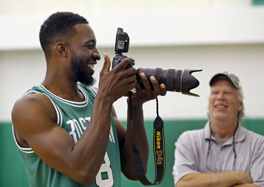 Boston Celtics forward Jeff Green shoots a picture as team photographer Steve Babineau laughs during Celtics basketball media day on Sept. 29 in Waltham, Mass. The Celtics play the Toronto Raptors on Wednesday night at the Cross Insurance Arena in Portland