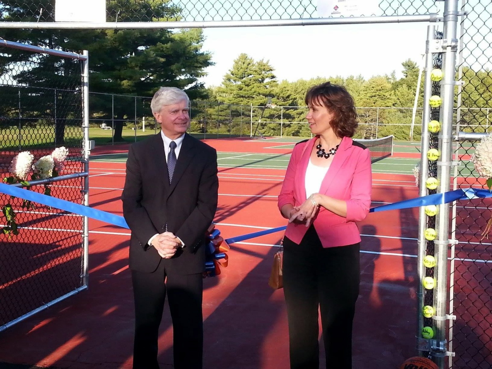 Theodore N. Scontras, executive vice president of The Bank of Maine, and Nancy R. Smith, vice president of The Bank of Maine, celebrate the ribbon cutting for new athletic facilities at Good Will-Hinckley recently. The Bank of Maine, the Eskelund family and the Red Sox Foundation made donations to complete the project.
