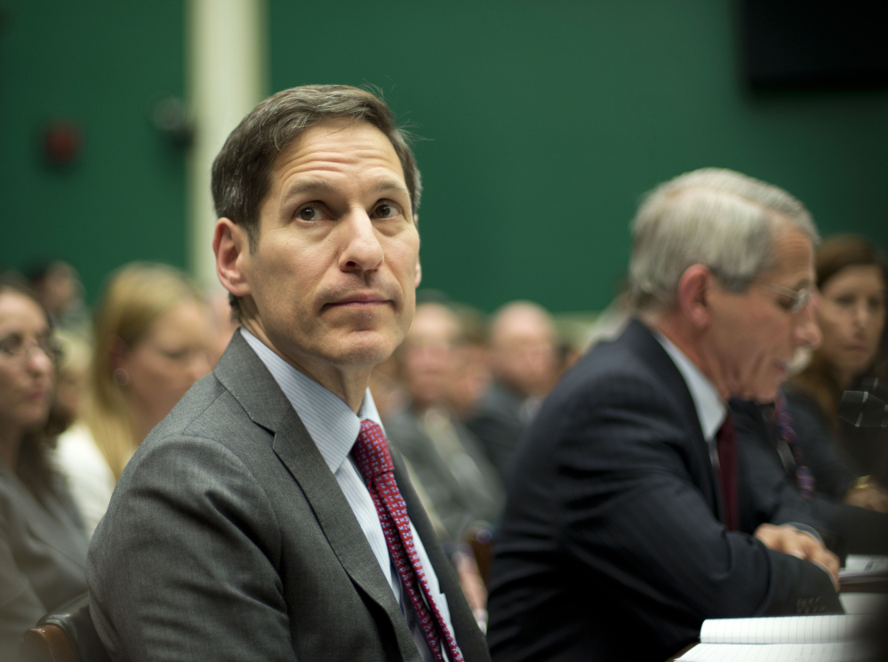 Centers for Disease Control and Prevention Director Dr. Tom Frieden testifies on Capitol Hill in Washington on Thursday at a hearing to examine the government’s response to contain Ebola. At right is Dr. Anthony Fauci, director of The National Institute of Allergy and Infectious Diseases.