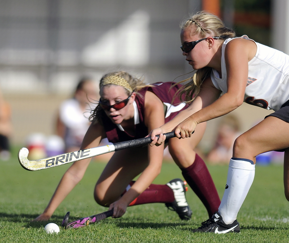 Gardiner’s Emily Malinowski, right, drives past Nokomis’ Shannon Kasprzak during a field hockey game earlier this season in Gardiner. The Tigers won 3-0. Gardiner earned the top seed in Eastern Class B and will host Erskine at 3 p.m., Wednesday in a quarterfinal game.