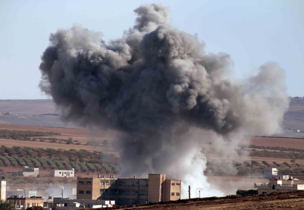 U.S.-led coalition warplanes make an airstrike in Kobani, Syria, Monday. Kobani, also known as Ayn Arab, has been under assault by Islamic State forces since mid-September and is being defended by Kurdish fighters.