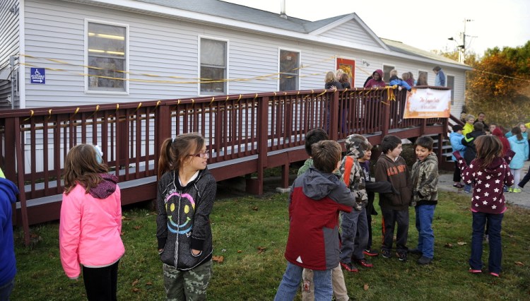 Dresden Elementary School students return to class on Monday after dedicating the Kenyon Center for Arts and Literacy, a modular structure that received a substantial gift from a fund started by the parents of Nate Kenyon.