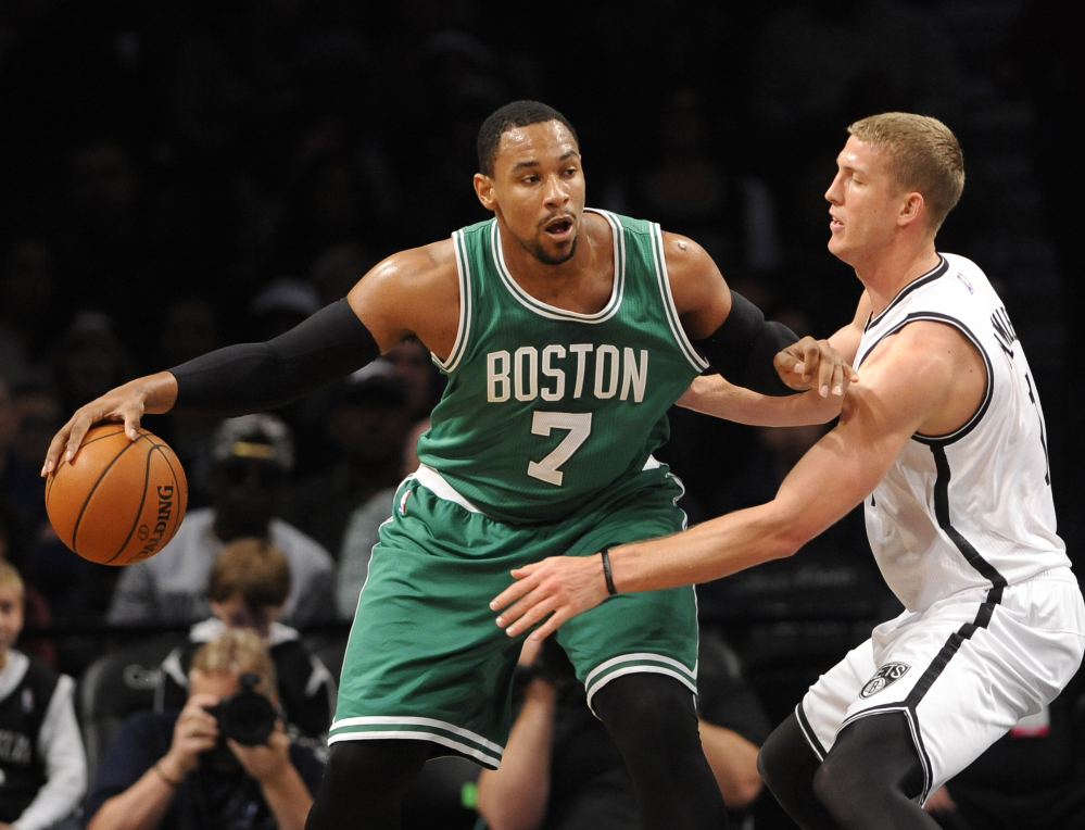Boston Celtics center Jared Sullinger (7) looks to pass the ball around Brooklyn Nets forward Mason Plumlee during the first half of a preseason game Sunday at Barclays Center in New York.