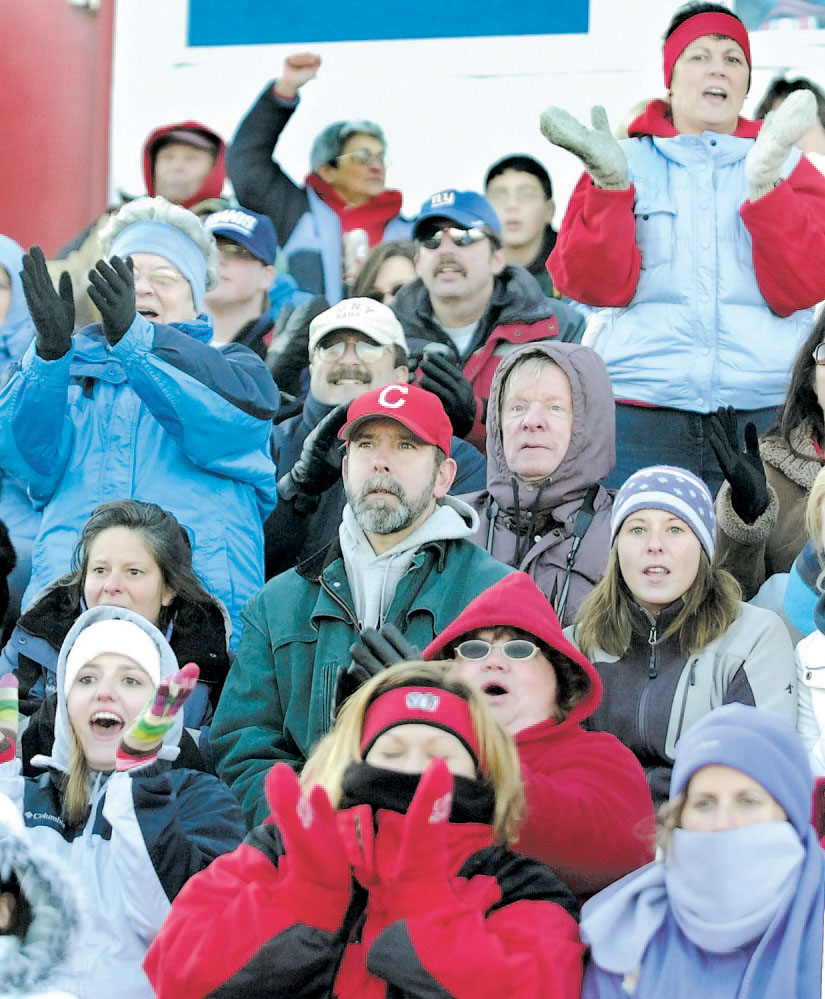 Cony High School fans cheer their football team during the 2007 showdown with Gardiner in Augusta.