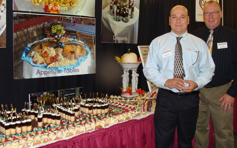 Steven Dumas Catering of Whitefield recently won first prize at the Kennebec Valley Chamber of Commerce Expo in Augusta. Of the 76 vendor member exhibits, the catering company was chosen for “his unbelievable display of delicious confections” as described by Chamber President, Peter Thompson, in a letter to KV Chamber members. From left are Steven Dumas and Wyatt Shorey of Steven Dumas Catering.