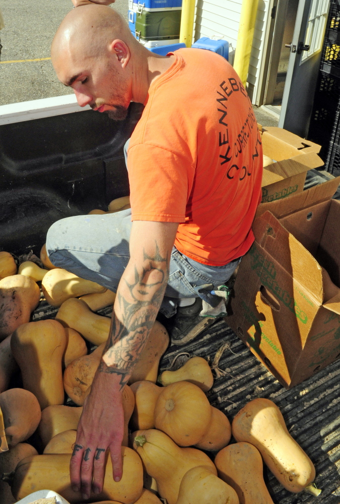 Joe Phelan/Staff Photographer
Kennebec County Correctional Facility inmates pick potatoes in Augusta late last month.