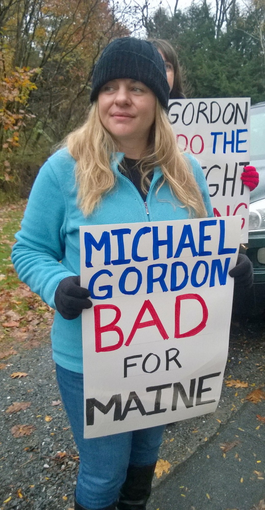 Amanda Way, a customer service representative at FairPoint, at the entrance to Colby College in Waterville where union members picketed the arrival of a Colby trustee, Michael Gordon, who is chief investment officer of a hedge fund that union members said owns a significant stake in FairPoint.