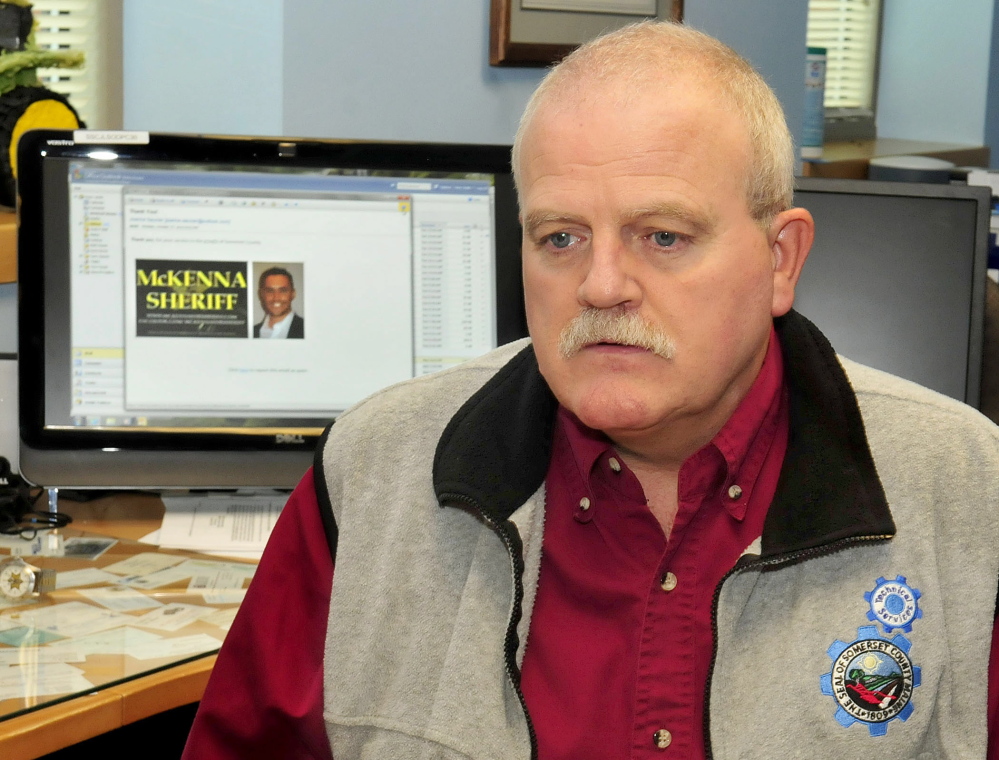 Somerset County IT Director Peter Smith on Wednesday, speaks about the email spam that county officials received regarding Somerset Sheriff candidate Kris McKenna whose image, on computer screen, appeared Monday. Smith said the spam message cost the county money and time.