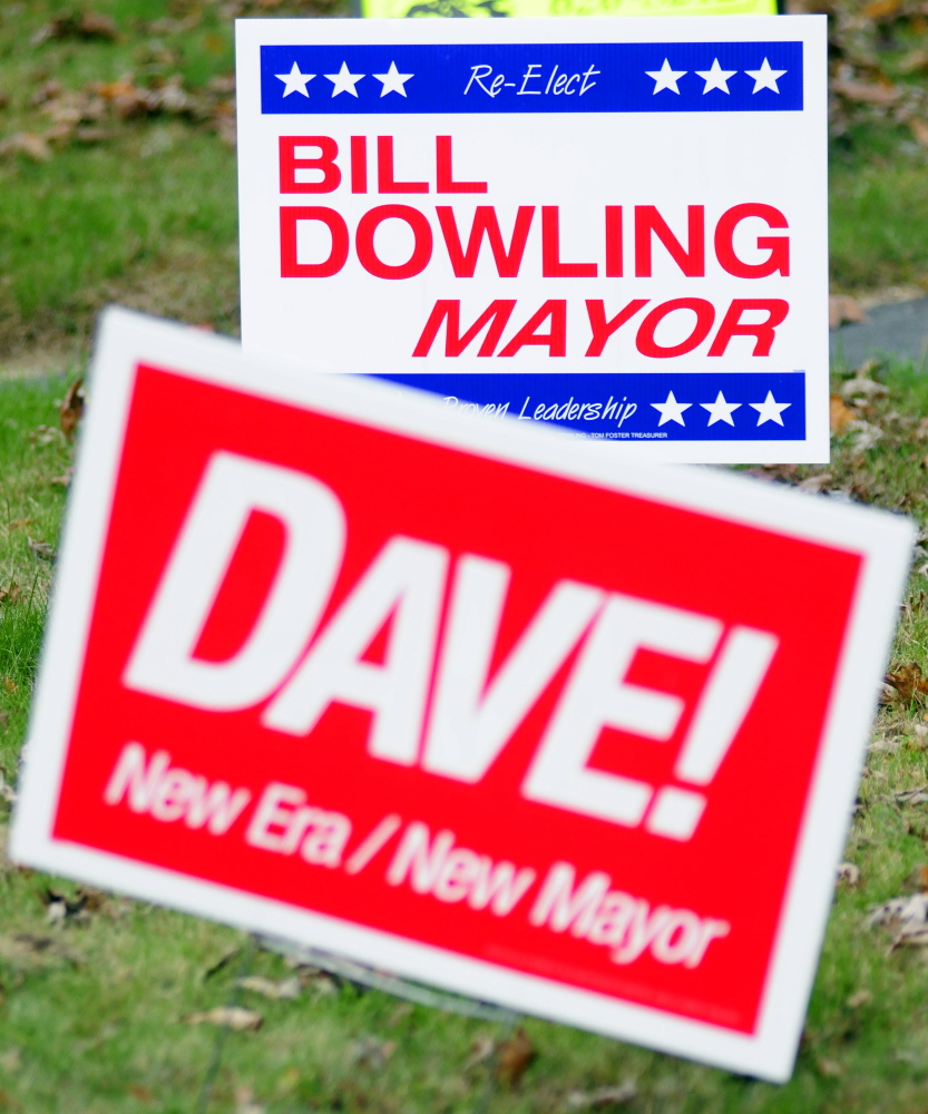 Signs for the two of the candidates for mayor are seen on Northern Avenue on Friday in Augusta.