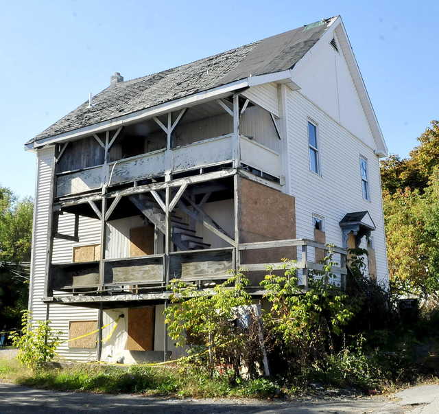 The boarded-up home at 26 Gold St. in Waterville, shown as it appeared Monday, is the subject of a Waterville City Council discussion of whether to declare it dangerous, have it demolished and bill the owner for the demolition cost.