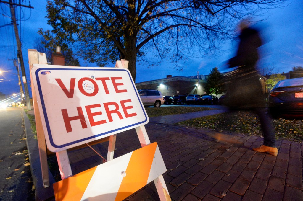 Voters make their way to the polls at the Reiche Community School in Portland in 2014. The school will hold classes on Election Day this year  because the polling location is apart from the classroom and student space.