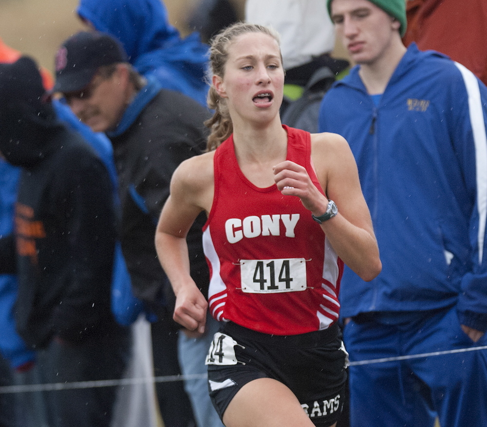 Cony’s Anne Guadalupi heads into the final stretch of the Class A state championship cross country race Saturday in Belfast.