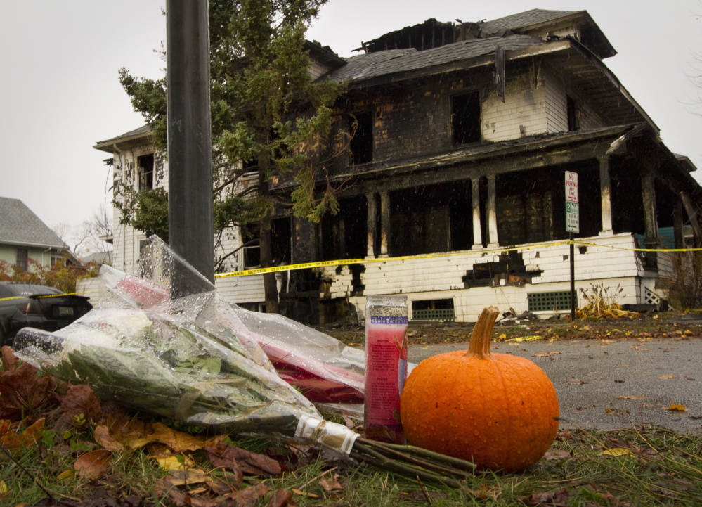 PORTLAND, ME - NOVEMBER 1: A shrine has started to grow Sunday morning on Noyes Street near the scene of a house fire which claimed five lives on Saturday . (Photo by Carl D. Walsh/Staff Photographer) .... ;ljkasdf;lkjasdf;lkj asdfl;kjasdf;jkl safd;ljks